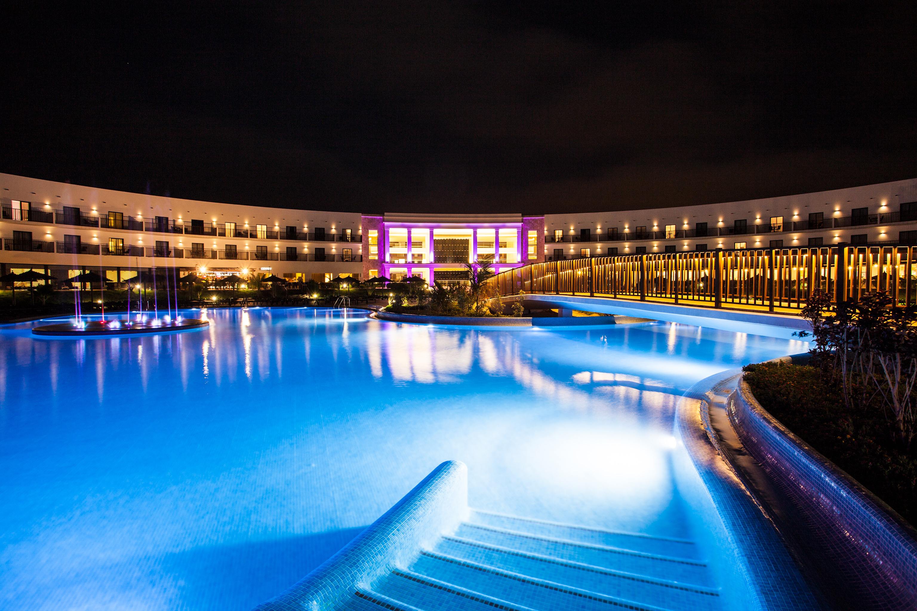 The pool and resort at night